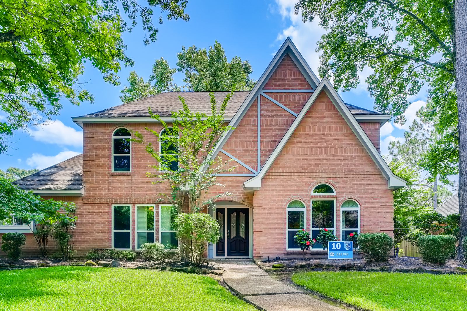 Traditional brick home with a landscaped front yard
