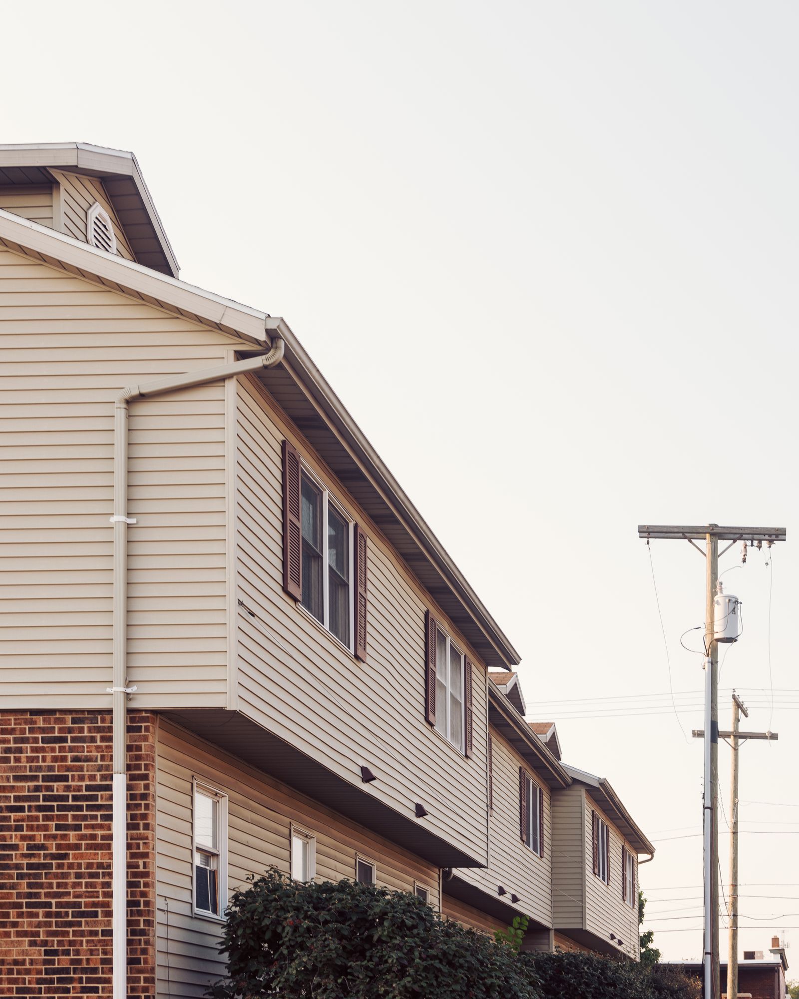 Attached residential homes with brick and siding exteriors